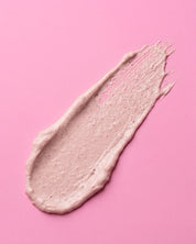 pink Beige cream smear on a pink background