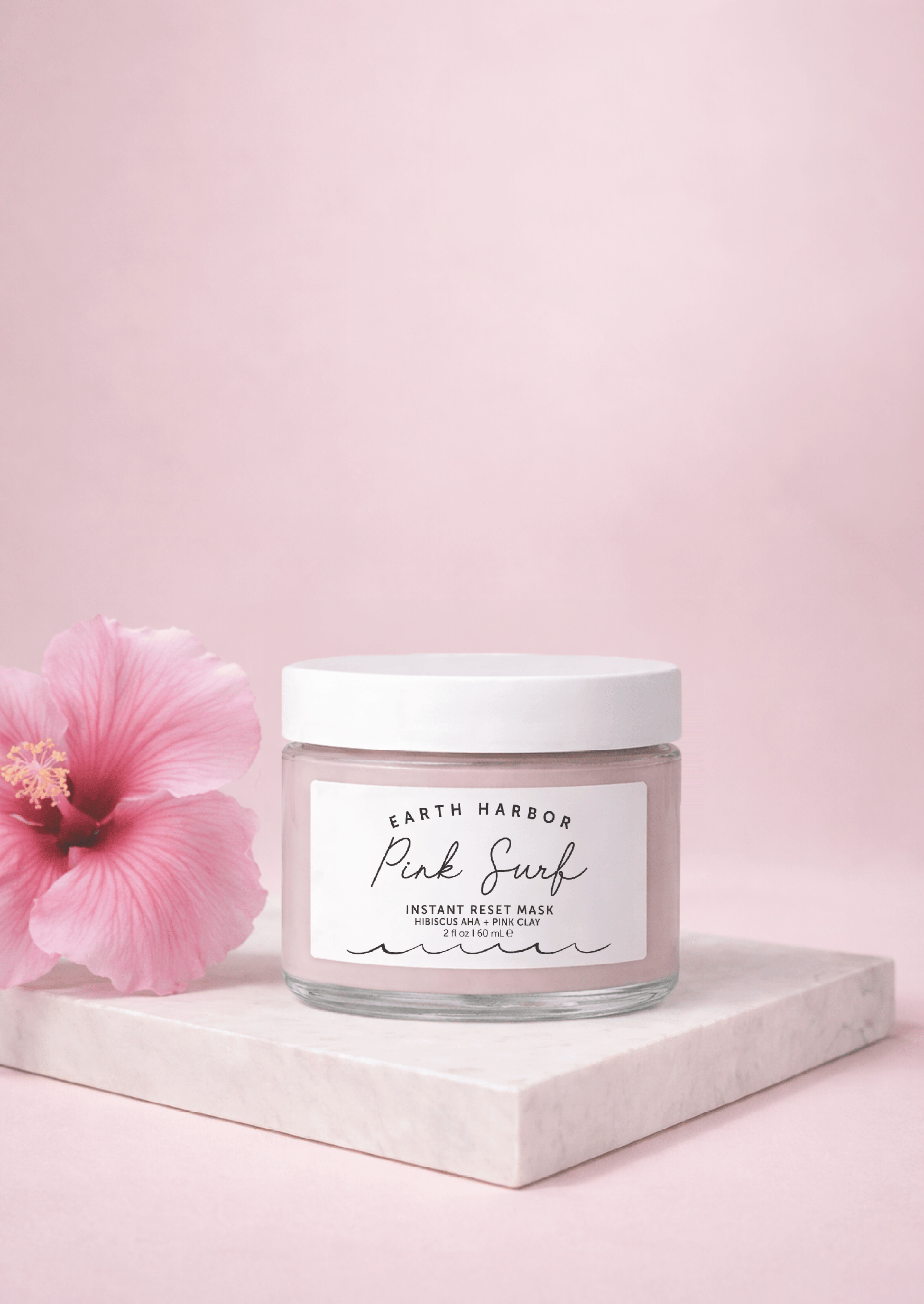 Jar of 'Pink Surf' instant mask with a pink flower on a light pink background
