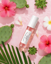Skincare bottle with flowers and cacti on a pink background
